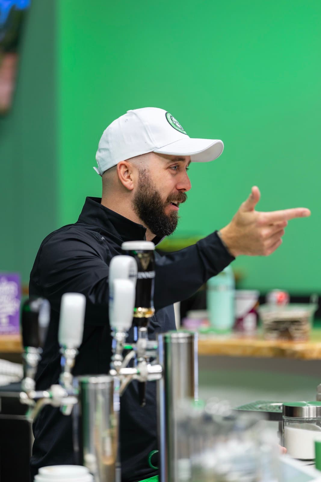 Bartender serving a drink in Kingston